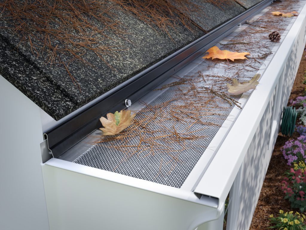 Sasquatch installed on a commercial roof edge with debris shed off the surface &mdash; the maintenance profile Texas roofing GCs point to when specifying the system to property owner and insurance stakeholders.
